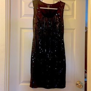 Black knee length sleeveless petite sequin dress